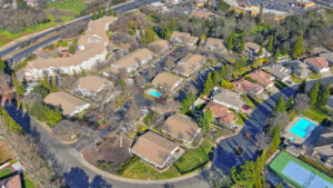 Exterior aerial of Woodcreek Terrace and surrounding areas, photo taken on a sunny day