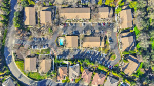 Exterior aerial of woodcreek terrace, top down view, Community Clubhouse/ pool in center.